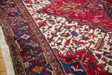 Charcoal and red geometric border and plush, full pile on a vintage Mehrivan carpet.