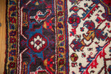 Original side cord selvage and full, plush wool pile of a vintage Mehrivan carpet.