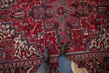 Rich wool pile showing the concentric medallion and floral details of a vintage Mehrivan carpet.