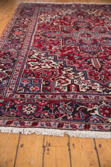 Detailed view of the vintage Mehrivan rug's turtle design border and intact original fringe.