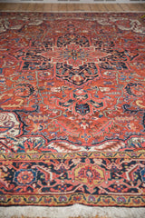 Low angle perspective of a vintage Heriz carpet highlighting its full, dense wool pile and pattern.
