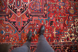 Richly colored geometric patterns and plush, full pile on a vintage hand-knotted Heriz carpet.