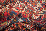 Soft folds of a vintage Heriz carpet reveal its full pile and detailed floral pattern.