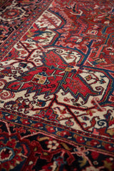 Dramatic sharp contours and full hand-knotted pile of a vintage Persian Heriz carpet.