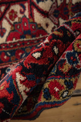 A close view of the full, hand-knotted wool pile on a vintage Persian Heriz.
