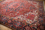 Richly saturated gem tones in the Heriz-style floral patterns of a vintage Persian Ahar carpet.