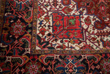 Close-up of a vintage Ahar carpet's full wool pile and intricate corner design.