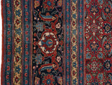 Reciprocating turtle design motif and inner palmette on the wide, sapphire blue border of a vintage Tabriz.