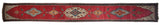 Full design of a collector's antique Karabagh runner with pictorial birds and central geometric medallions.