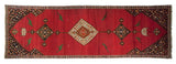 Antique Karabagh runner with bird motifs and medallions on an abrashed cochineal red ground.