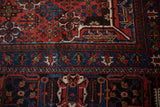 Detail of Joshegan rug's sapphire blue border with reciprocating pawn design motif.
