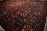 Vine arabesque palmette and pawn motif borders on a vintage Joshegan carpet.