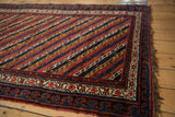 Antique Kurdish runner corner with a bold pawn motif border and original side cord selvage.