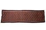 Antique Kurdish runner with diagonal vine stripes in red, blue, and ivory, framed by a pawn motif border.