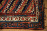 Bold pawn motif border and original intact selvage on a hand-knotted antique Kurdish runner.