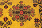 Close-up of a Daulatabad rug medallion with ram's horn finials and blossomed plants.