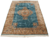 Vintage Kerman carpet corner, blue field meets intricate floral beige border and fringe.