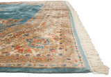 Intact side cord selvage, fringe, and plush floral border of a vintage Kerman carpet.