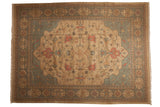 Indian Soumac carpet featuring Serapi-inspired botanical motifs in ivory, slate gray, and terracotta.