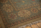 Soumac carpet corner with detailed Serapi-inspired patterns, fringe, slate gray, ivory, terracotta.