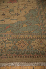 Intact fringe and corner detail of the Indian Soumac carpet, showing terracotta and slate gray.