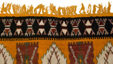 Saffron yellow fringe and jet black geometric border on a plush, hand-knotted Moroccan rug.