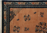 Peking carpet corner with intricate scrolling vinery, floral roundel on pale apricot, and varied blue borders.