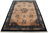 Pale apricot field of vintage Peking rug with cobalt blue floral roundel medallions and scrolling vinery.