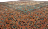 A corner detail of the Kerman carpet's floral borders in cochineal red and powder blue.