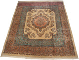 Vintage Kerman carpet from an angle, showing its ivory medallion and floral sky blue field.