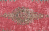 Blossomed floral spray and trefoil shield motif within a vintage Kerman carpet's medallion.