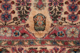 The like-new, full pile of a vintage Kerman carpet showing a trefoil shield motif detail.