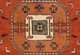 Geometric central medallion with hook and latch motifs and stylized birds in terracotta, blue, and ivory.