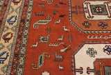 Playful birds, animals, and geometric motifs on a vintage Meshkin rug's terracotta field.