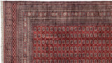 Detailed corner of a fine Bokhara rug showcasing the intricate weave of its geometric borders.