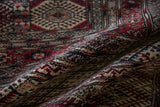 Soft folds highlighting the dense, full pile of a finely knotted Pakistani Bokhara rug.