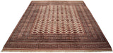 Angled view of a vintage Pakistani Bokhara carpet showing the repeating gul medallions and detailed borders.