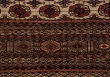 Detailed view of the Bokhara-style gul medallions and intricate geometric borders in brick red and navy.