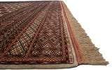 Intact side cord selvage and intricate geometric border of a vintage Pakistani Bokhara carpet.