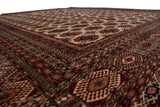Vintage Bokhara carpet corner with finely woven geometric borders and a plush, high-sheen wool pile.