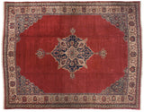 Vintage Oushak carpet with a navy blue diamond medallion and corner spandrels on a black cherry red field.