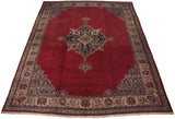An angled view of the oversized vintage Oushak carpet showing its full design and scale.