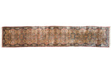 Vintage Persian Kerman runner with ornate shadow medallions and floral sprays on an ivory field.