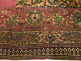 Main border detail of an antique Khorassan rug showing palmettes, lotus flowers, and a reciprocating pawn motif.