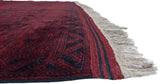 Full red wool pile and intact side selvage on a vintage Afghani Ersari carpet.