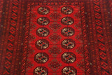 Close-up of the repeating floral gul motif and narrow borders on a vintage Daulatabad rug runner.