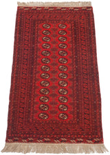 Angled perspective of the vintage Daulatabad runner with its repeating red gul pattern and dark borders.