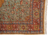 Ornate floral corner spandrel and brick red border of a vintage hand-knotted Tabriz design carpet.