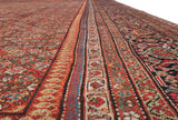 Intricate Samovar turtle design border and Herati field of a late 19th-century Persian Fereghan carpet.