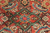Saturated red, blue, and green wool pile in the detailed Herati motif of an antique Fereghan carpet.